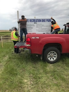 the public works crew setting up the sign